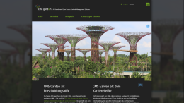 Home page in dark mode. The main image shows artificial tree structures in a park
