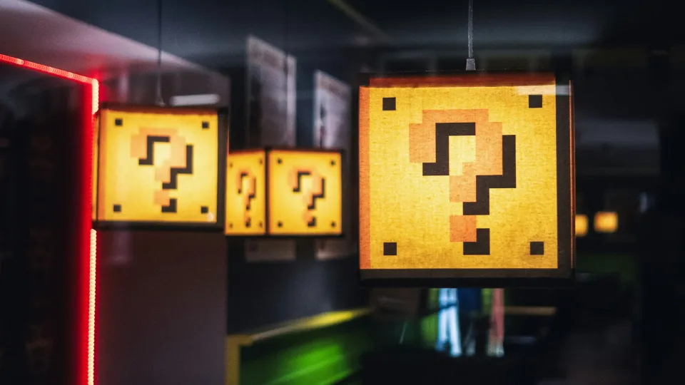 Hanging lamps decorated with pixel-style question marks